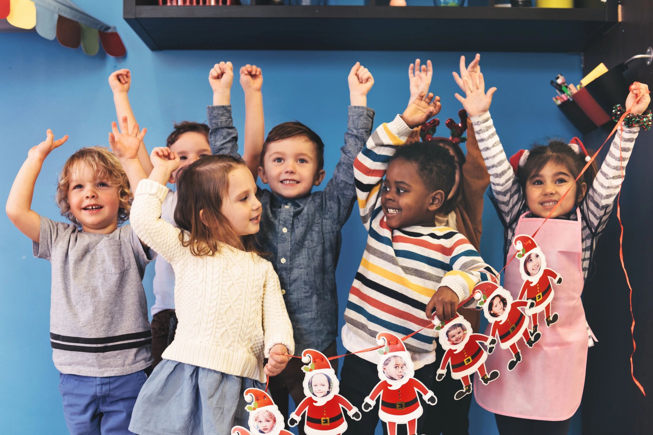 happy family with Santa Claus Christmas party event festive