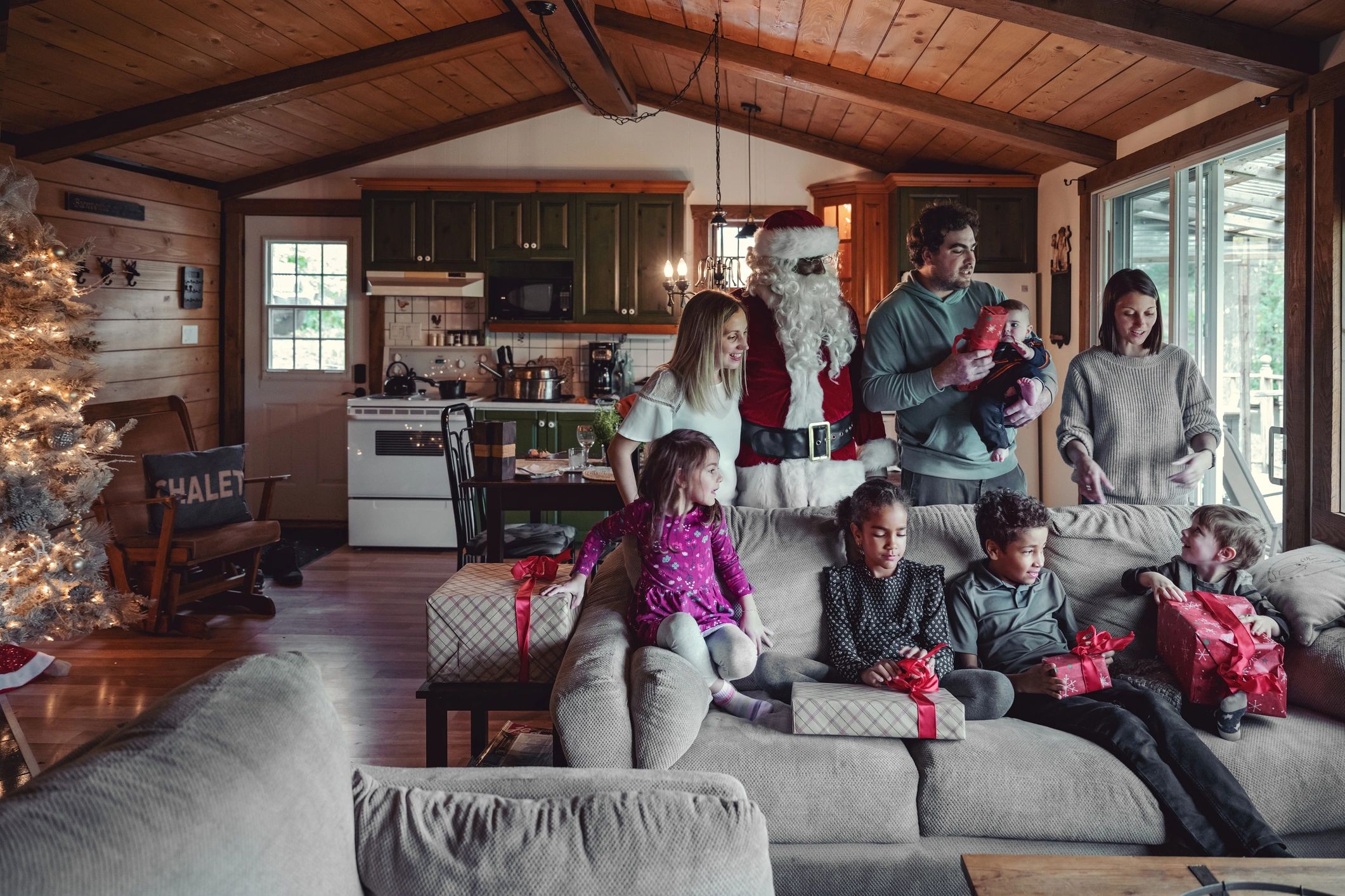 Santa Claus home visit, family, children, Christmas tree, joyful