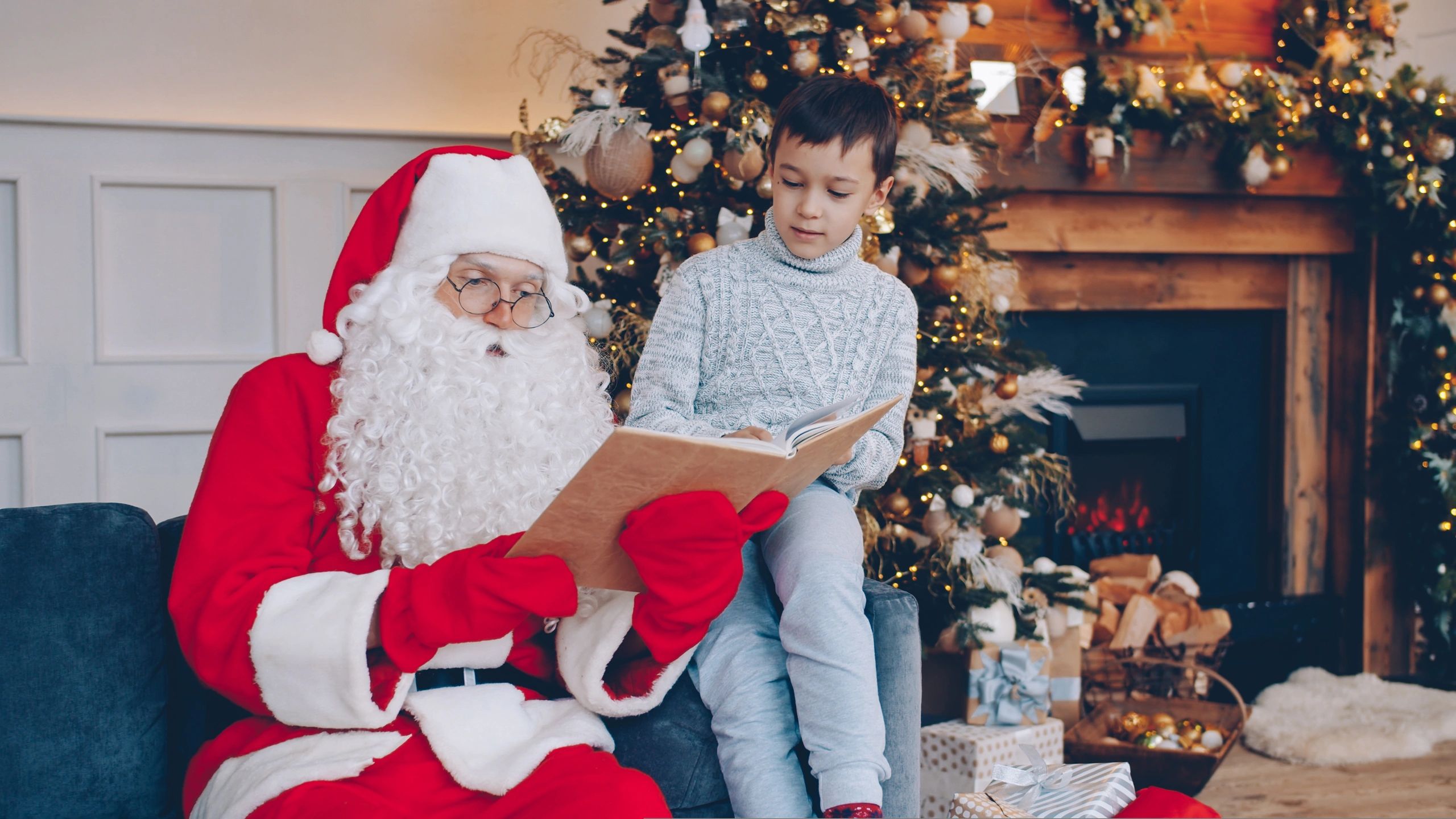 Santa reading to a group of children