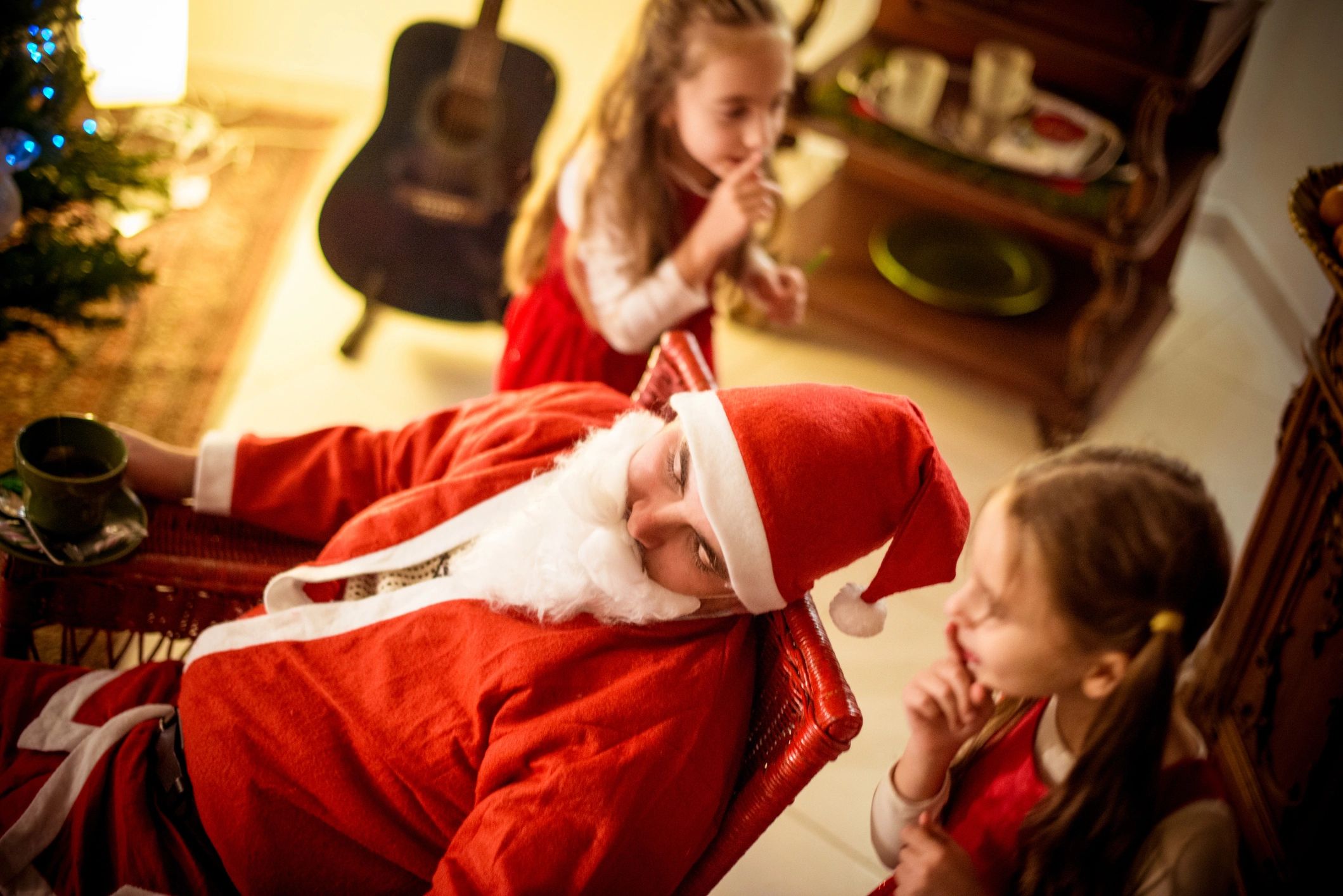Santa Claus at Christmas party with children, festive, joyful, playful, professional